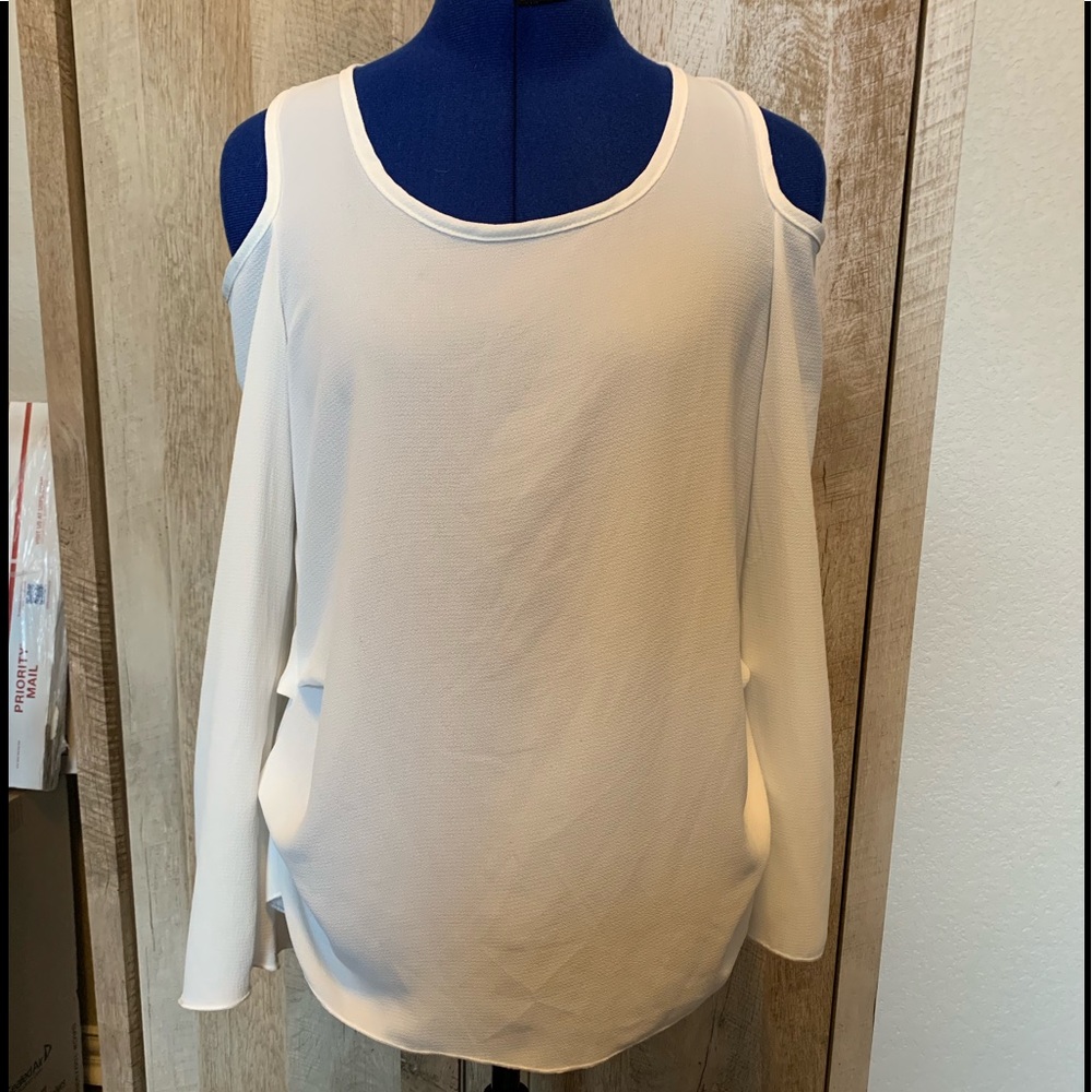Super cute cut-out shoulder blouse.
